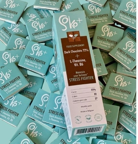 Soko+ Stress Fighter dark chocolate supplements featuring premium teal and white packaging. These products are strategically positioned for Supplement Brand International Distribution.